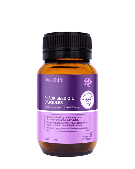 Amber oil in glass with black seeds—Hab Shifa Black Seed Oil vibe